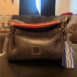 Dooney & Bourke Florentine mini tassel bag navy. Made in America. Like new.